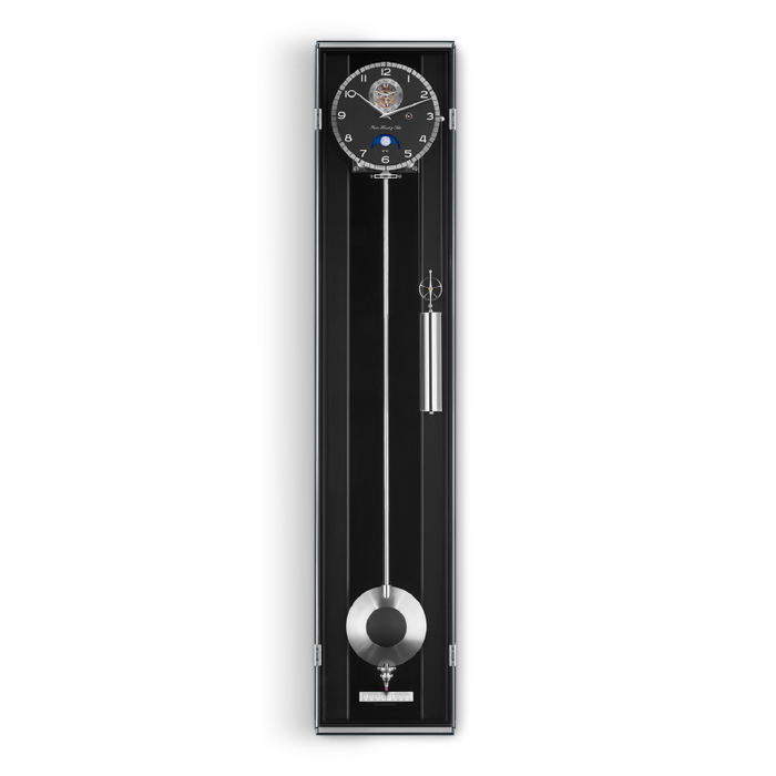 Black wall clock with silver pendulum on a white background