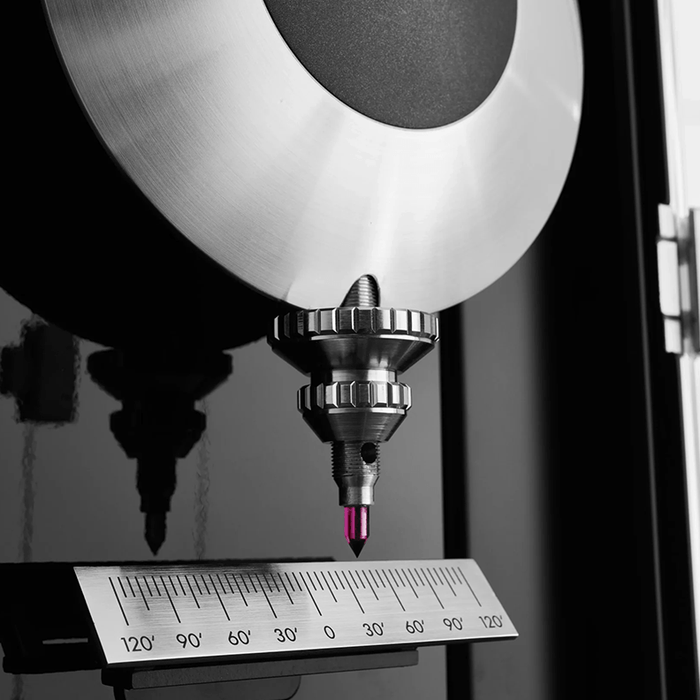 Metal pendulum of luxury clock with ruby point. 