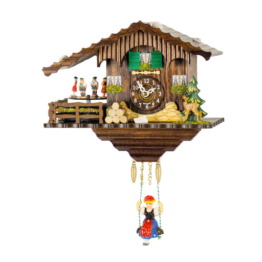 Ornate wooden cuckoo clock with deer and girl on swing figurines on white background.