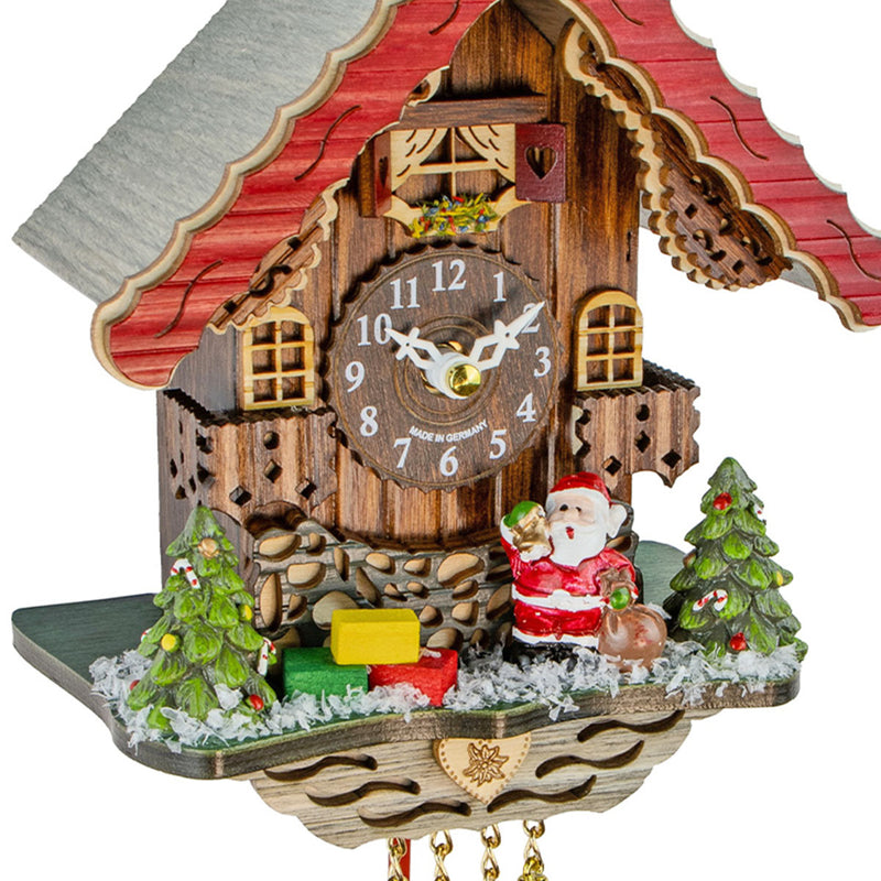 Close-up of Santa Claus themed cuckoo clock.