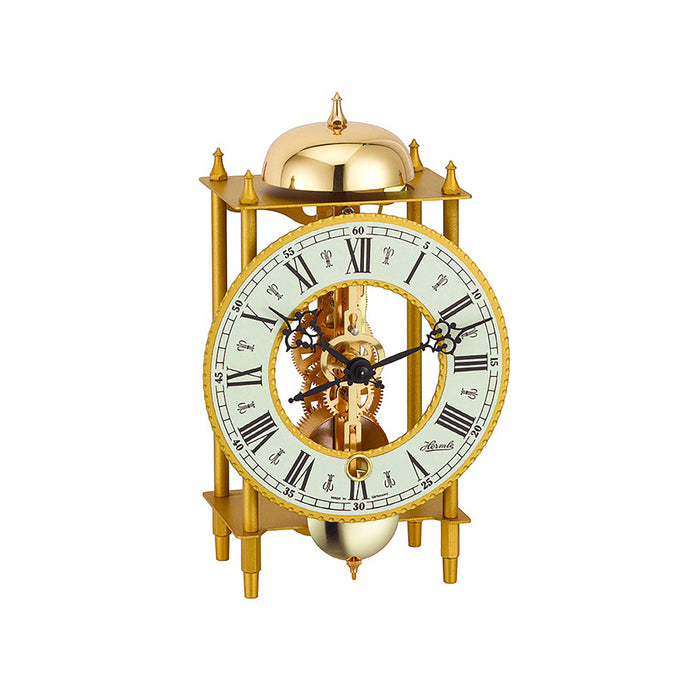 Brass mantel clock with visible intricate gears on white background