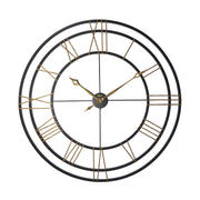 Large round wall clock with black frame and gold Roman numerals on a white background