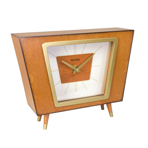 Retro style desk clock with brass highlights on white background.