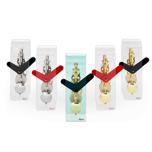 Set of five acrylic desk clocks with black and red hands, featuring silver and brass gears visible through clear case