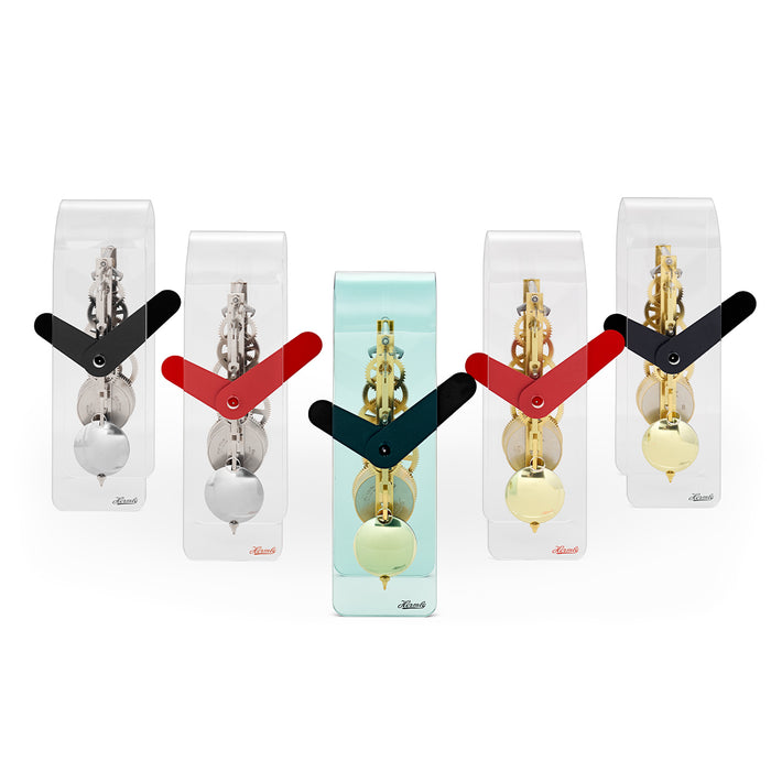 Set of five acrylic desk clocks with black and red hands, featuring silver and brass gears visible through clear case