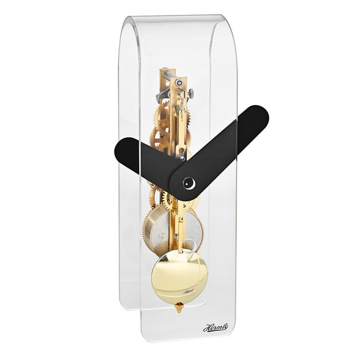 Clear acrylic desk clock with visible brass gearing inside and black hands