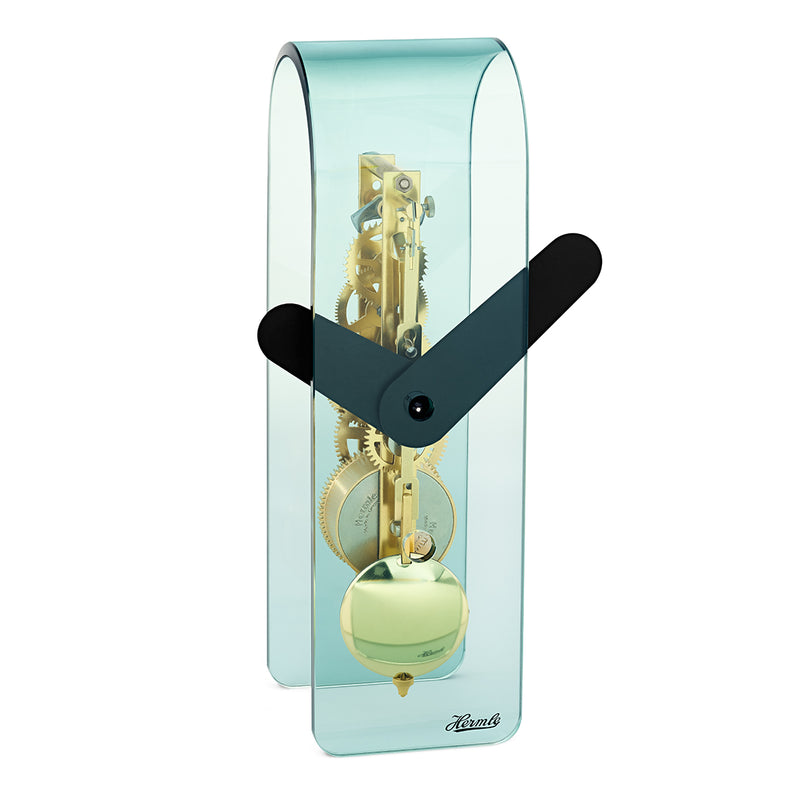 Transparent blue acrylic desk clock with visible brass gearing inside and black hands
