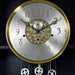 Up close of brass and nickel grandfather clock face