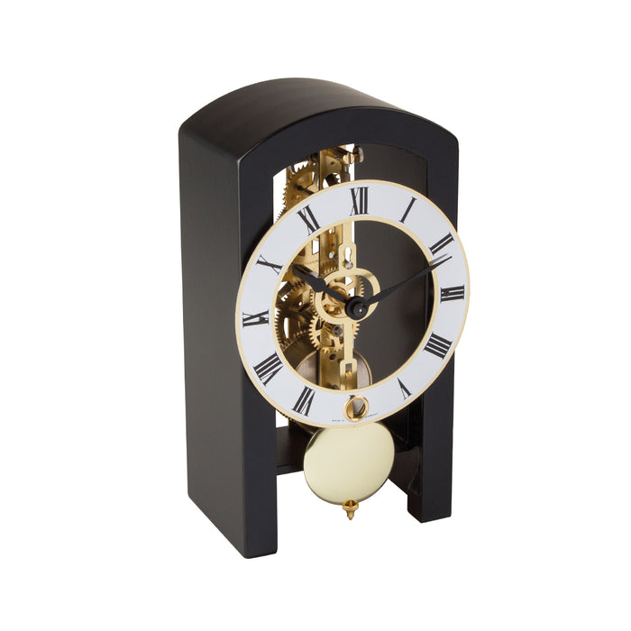 Mechanical clock with black casing and silver face on a white background