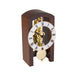 Mechanical clock with walnut casing and silver face on a white background