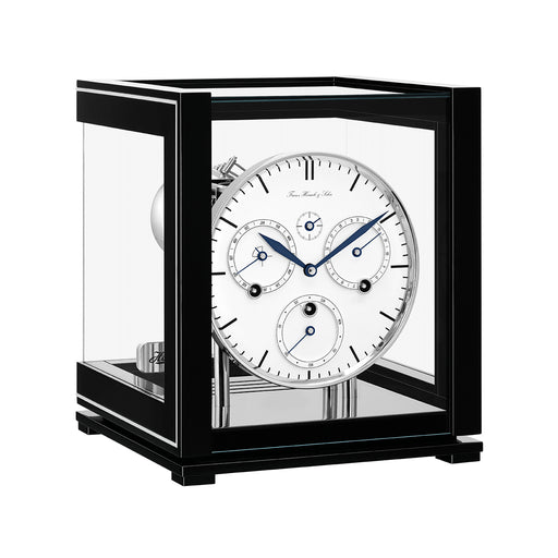 Black perpetual calendar clock with white face, silver highlights and glass panels on white background.