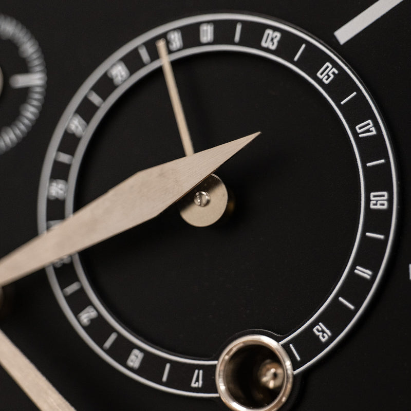 Close up of day dial on mechanical perpetual calendar clock.