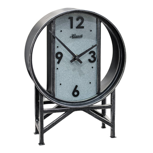 Vintage style metal clock with framework legs and large numbers on white background.