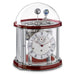 Red and silver Tellurium clock with glass dome and nickel plated mechanical gears visible on white background.