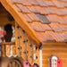 Close up of wooden shutters on the roof of decorative cuckoo clock 