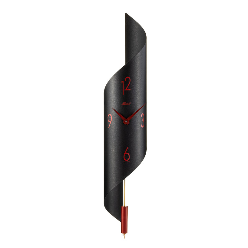 Black finish abstract clock with red finish pendulum on white background.