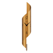 Gold finish abstract clock with brass finish pendulum on white background.