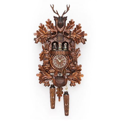 Wooden cuckoo clock with intricate carved leaves and animals around roman numeral face