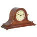 Cherry wood Tambour style mantel clock with ornate design and Hermle logo on face. 