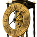 Close up of antique-style brass clock face and gears on white background.