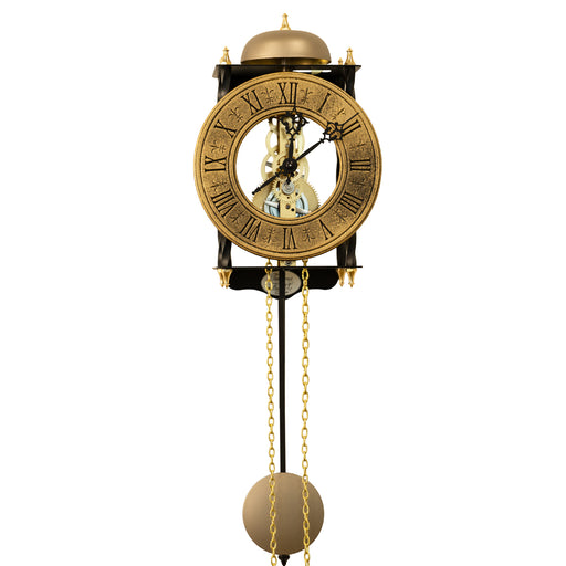 Skeleton clock with antique-style brass face and etched roman numerals on white background.