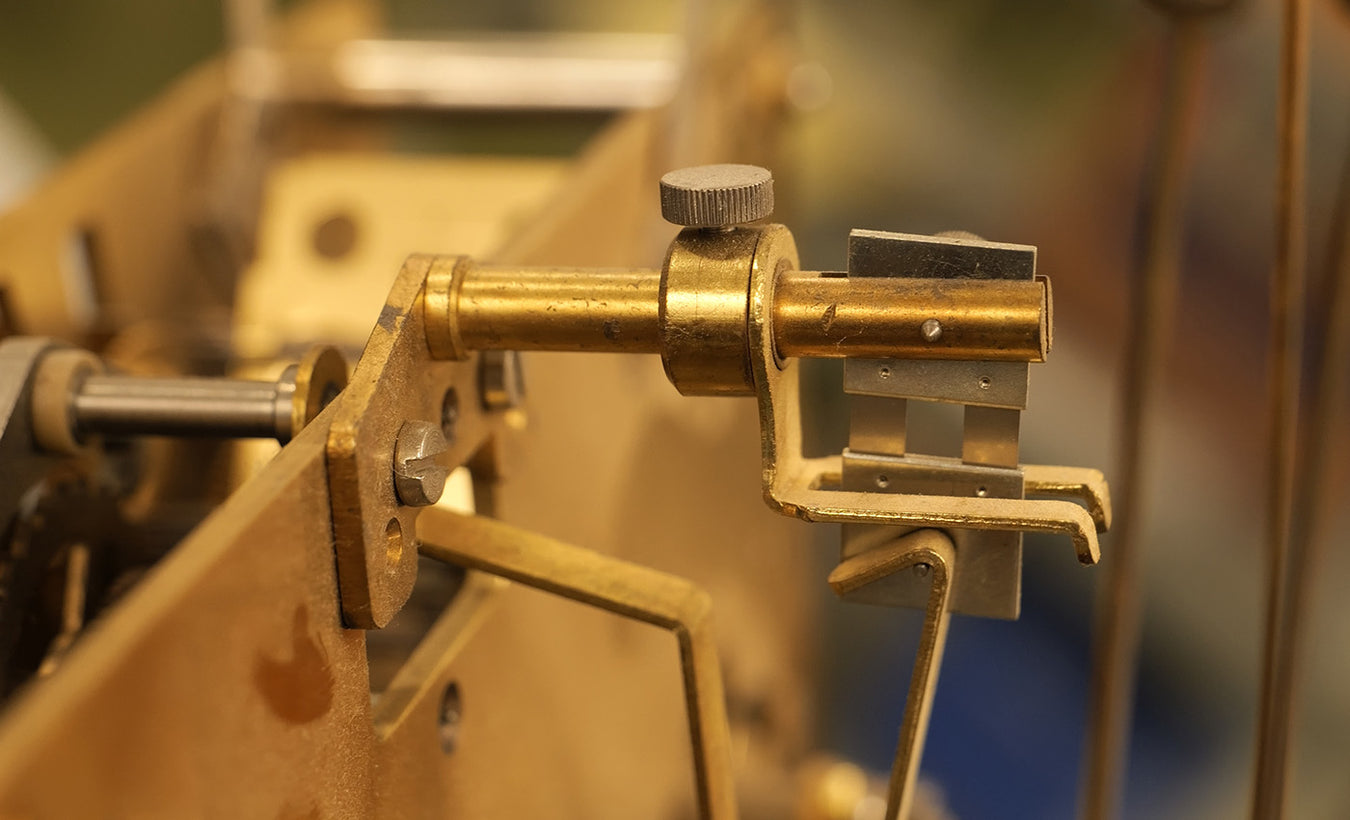 How to change out a clock's suspension spring