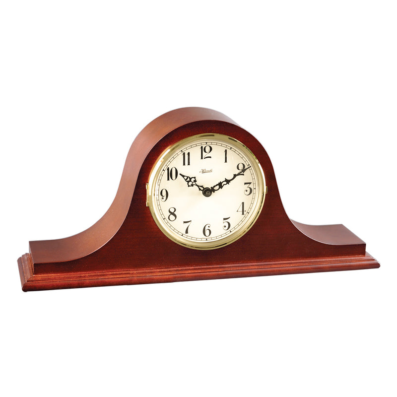 Wooden mantel clock with white face, brass highlights and black hands on a white background.