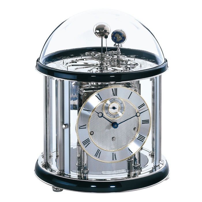 Black and silver Tellurium clock with glass dome and nickel plated mechanical gears visible on white background