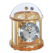 Cherry wood and brass Tellurium clock with glass dome and brass plated mechanical gears visible on white background.