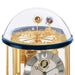 Glass Tellurium dome with brass Sun and Earth globes mounted on intricate gears on white background.