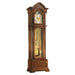 Detailed wooden grandfather clock with brass clock face and tube bells on a white background