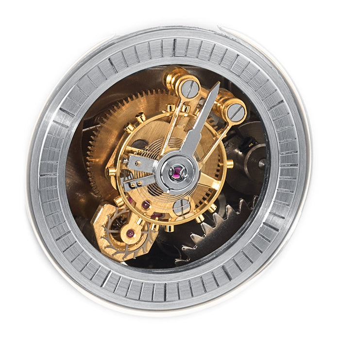 Close up of Tourbillion mechanism with intricate brass and silver gears on white background.
