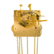Brass clock movement with visible gears and hanging chains.