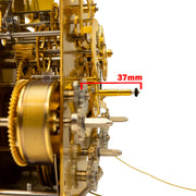 Close up of clock movement front post measurement and text saying '37mm' on white background.