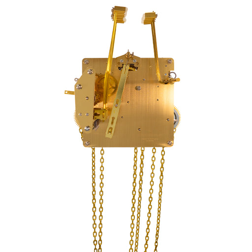 Brass UW32334 clock movement back with visible gears, hammers and hanging chains on white background.
