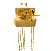 Brass UW32334 clock movement front with visible gears and hanging chains on white background.
