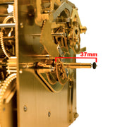 Close up of front post on brass clock movement with text saying '37mm' and measurement line on white background.