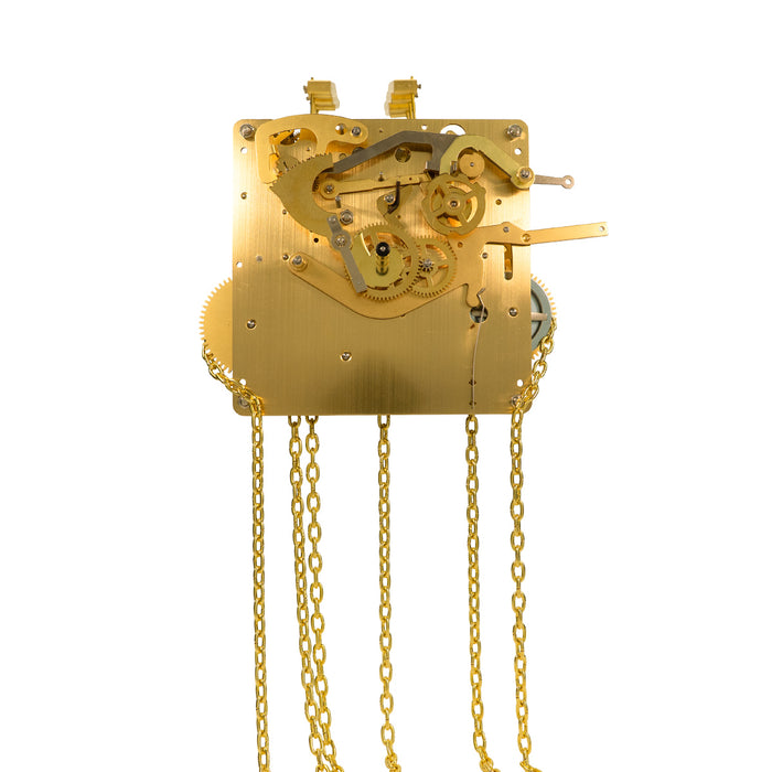 Brass clock movement with visible gears and hanging chains on white background.