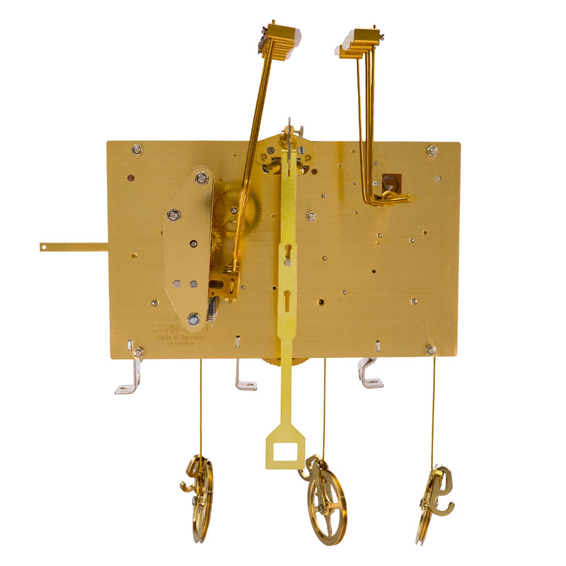 Wide brass clock movement with visible gears on white background.