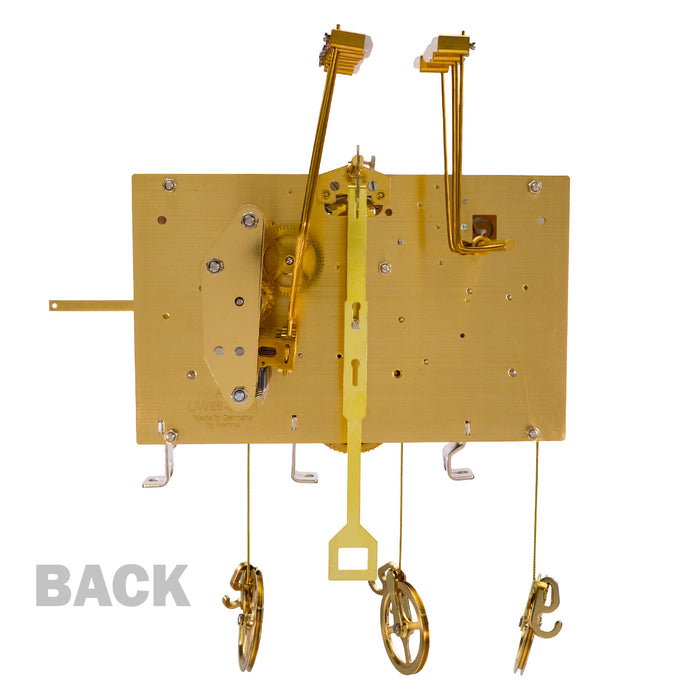 Brass clock movement with visible gears and hammers with 'Back' title.