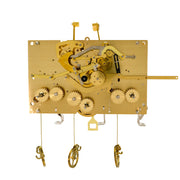 Wide brass clock movement with visible gears and hammers on white background.