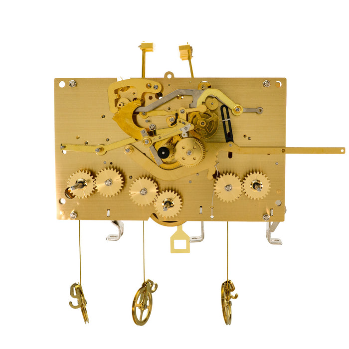 Wide brass clock movement with visible gears and hammers on white background.