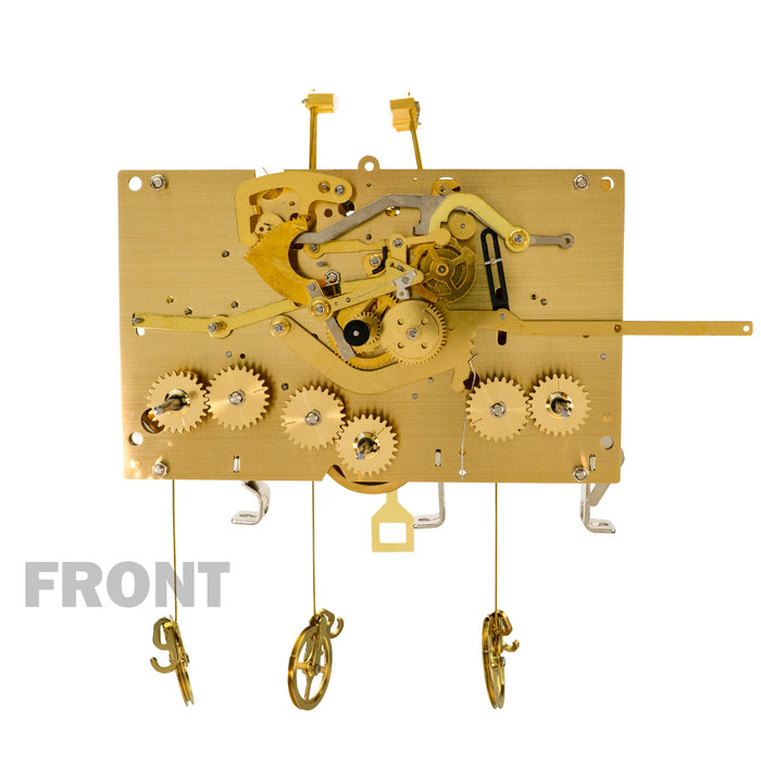 Brass clock movement with visible gears and 'Front' title.