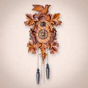 Cuckoo clock hanging on white wall in living room