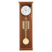 Light cherry wood regulator wall clock with brass highlights on white background